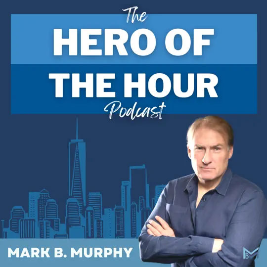 The image features a graphic design with text overlaying an image of a man standing in front of a cityscape. The text includes the name Hero of the Hour and mentions a podcast episode featuring Mark B Murphy.